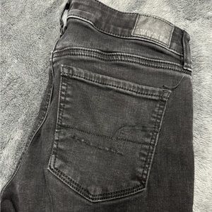 American Eagle Women’s Distressed Stretch Jeans, Size 2 and color is black.